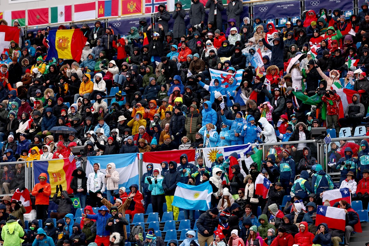 epa12738215 Fans react on the tribune in finish area during the Men's Giant Slalom of the Alpine Skiing competitions at the Milano Cortina 2026 Winter Olympic Games, Stelvio ski centre in Bormio, ...