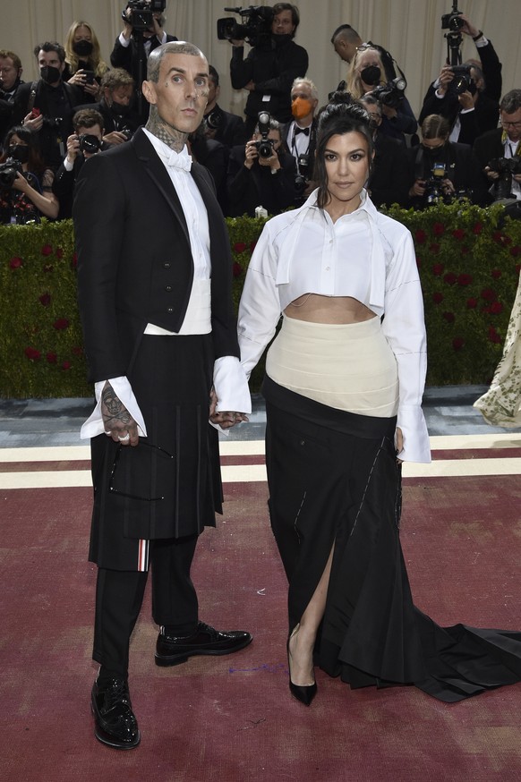 Travis Barker, left, and Kourtney Kardashian attend The Metropolitan Museum of Art's Costume Institute benefit gala celebrating the opening of the "In America: An Anthology of Fashion" ...