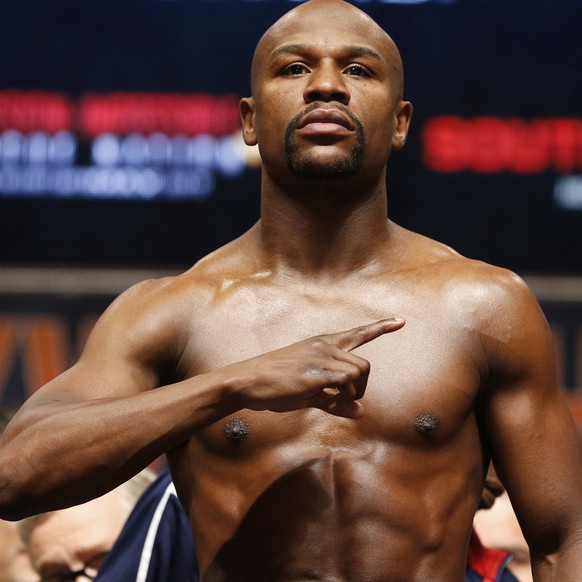 Floyd Mayweather Jr. poses during his weigh-in on Friday, May 1, 2015 in Las Vegas. The world weltherweight title fight between Mayweather Jr. and Manny Pacquiao is scheduled for May 2. (AP Photo/John ...