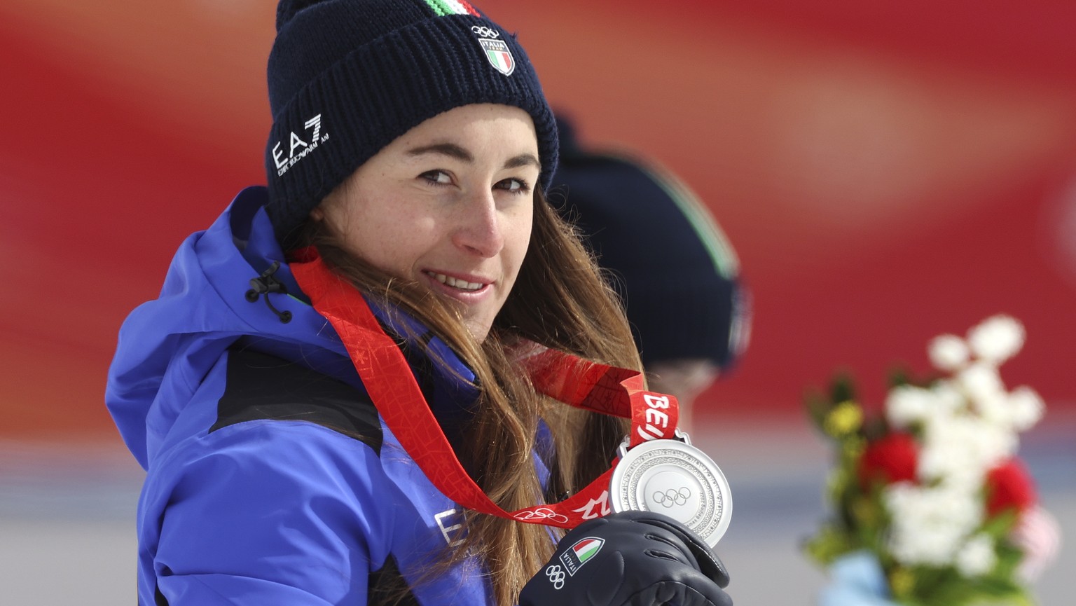 Sofia Goggia, of Italy, silver, reacts during the medal ceremony for the women&#039;s downhill at the 2022 Winter Olympics, Tuesday, Feb. 15, 2022, in the Yanqing district of Beijing. (AP Photo/Alessa ...