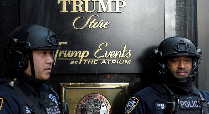FILE PHOTO -- Heavily armed New York City Police (NYPD) officers stand guard in front of Trump Tower where Republican president-elect Donald Trump lives in the Manhattan borough of New York, U.S., Nov ...
