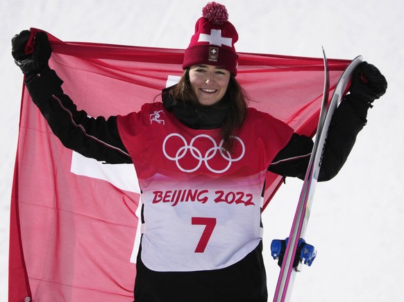 Gold medalist Mathilde Gremaud of Switzerland stands on the podium with her national flag after the Women s Freestyle Skiing Slopestyle competition at the 2022 Beijing Winter Olympics in Zhangjiakou,  ...