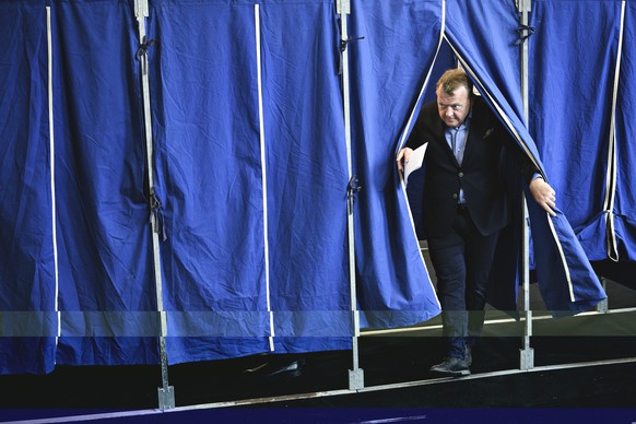 Demark&#039;s Prime Minister Lars Loekke Rasmussen from the Liberal Party walks out of a booth at Nyboder School during the European Parliament elections 2019 in Copenhagen, Sunday, May 26, 2019. (Phi ...