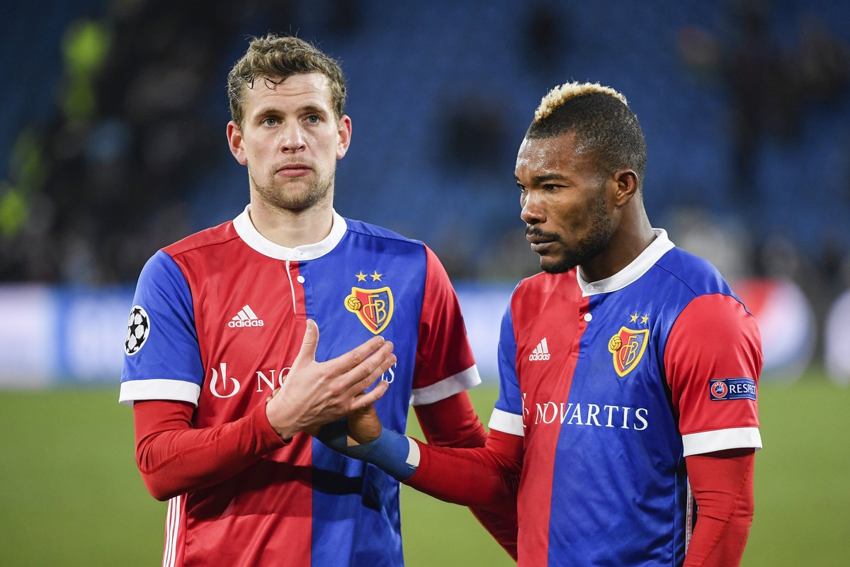 epa06522491 Basel's Fabian Frei (L) and Geoffroy Serey Die react after the UEFA Champions League round of 16 first leg soccer match between FC Basel and Manchester City in the St. Jakob-Park stad ...