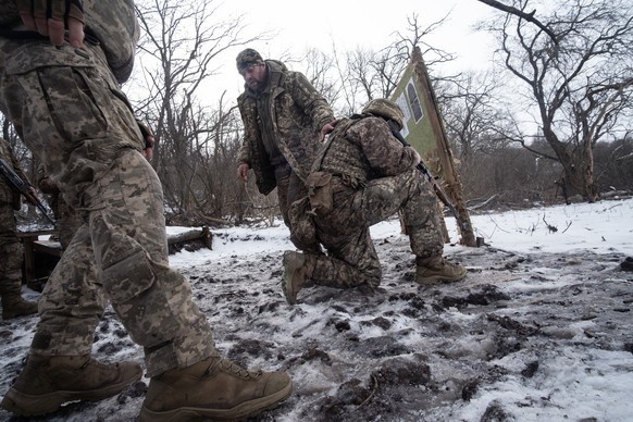 epa12763562 Ukrainian infantry soldiers of the Alcatraz Battalion, part of the 93rd Mechanised Brigade ìKholodnyi Yarî of the Army, during their intensive military training period ñ before being sent  ...