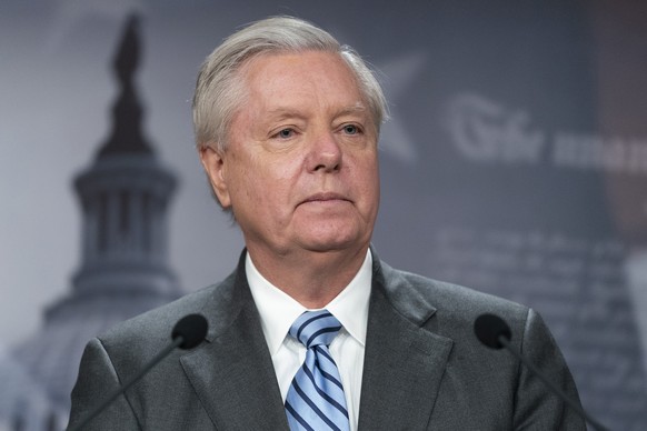 FILE - Sen. Lindsey Graham, R-S.C., speaks with reporters about aid to Ukraine, on Capitol Hill, Wednesday, March 10, 2022, in Washington. The Georgia prosecutor investigating the conduct of former Pr ...