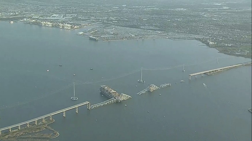 Parts of the Francis Scott Key Bridge remain after a container ship collided with a support Tuesday, March 26, 2024 in Baltimore. The major bridge in Baltimore snapped and collapsed after a container  ...