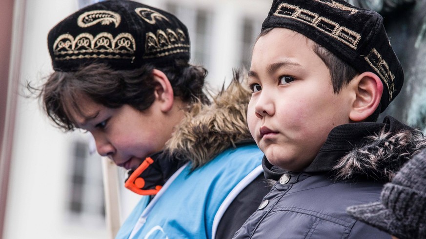 February 2, 2019 - Munich, Bavaria, Germany - Uyghur children in Germany protesting with the flag of East Turkestan, which is also known as the Xinjiang Autonomous Province. Over 400 primarily Turkish ...