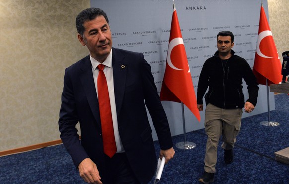 epa10646194 Former presidential candidate of the ATA Alliance, Sinan Ogan, leaves after a press conference in Ankara, Turkey, 22 May 2023. Ogan has declared his support for Turkish President Recep Tay ...