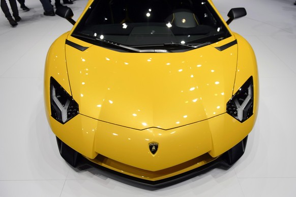 epa08414348 The new Lamborghini Aventador SV is on display during the press day at the 85th Geneva International Motor Show in Geneva, Switzerland, 03 March 2015 (re-issued 11 May 2020). Color Yellow  ...