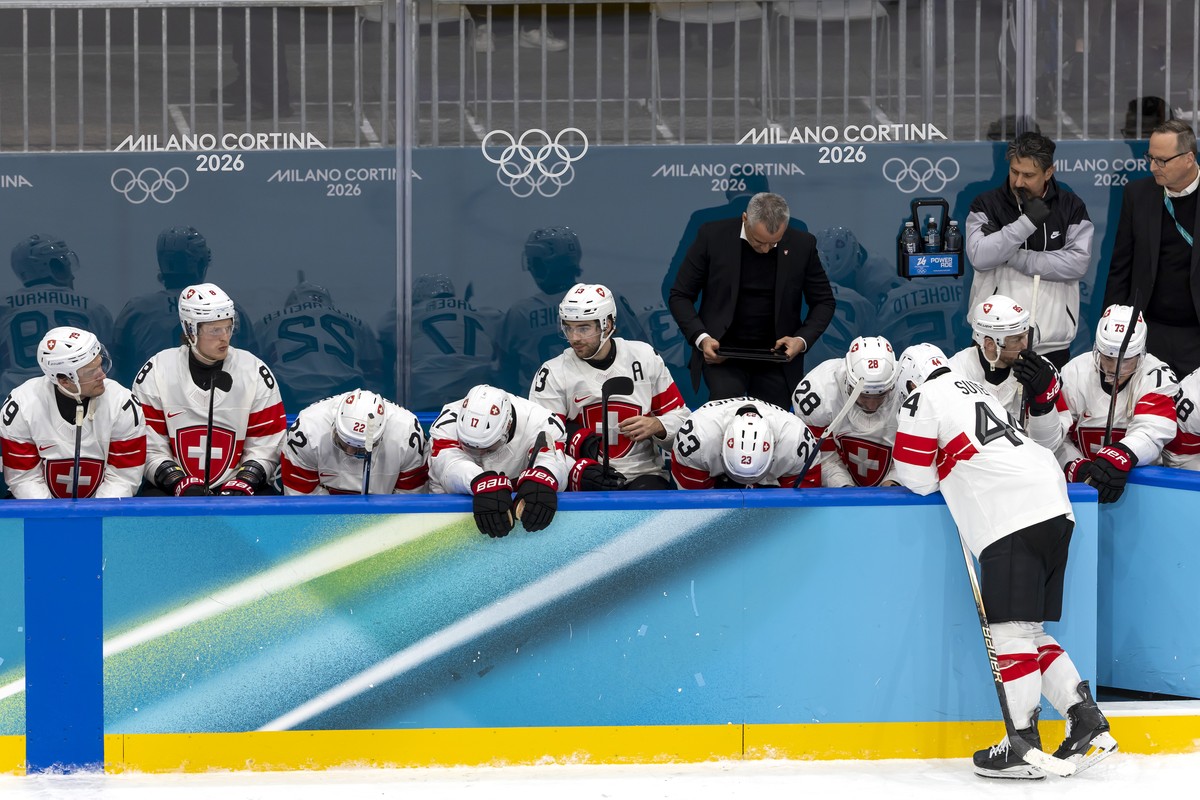 Switzerland's players look disappointed after losing against Finland during the overtime of men's ice hockey quarterfinal game between Finland and Switzerland at the 2026 Olympic Winter Game ...