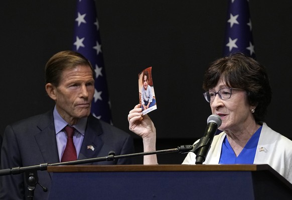 U.S. Senator Susan Collins, R-Maine, right, holds a picture of kidnapped Israeli girl Abigail Mor Edan ,as she speaks at a press conference in Tel Aviv, Sunday Oct. 22, 2023. Collins is part of a bipa ...
