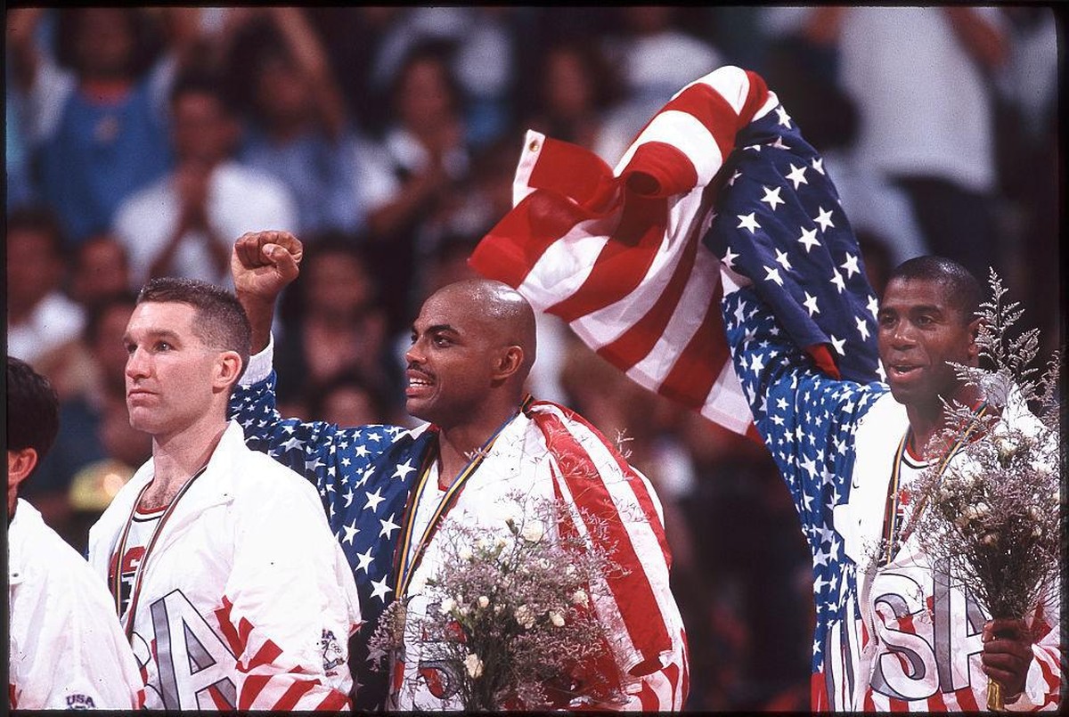 Aug 1992: Chris Mullin (L), Charles Barkley (M) and Magic Johnson (R) of Team USA, the Dream Team, on the victor's podium after winning the gold medal in the men's basketball competition at  ...