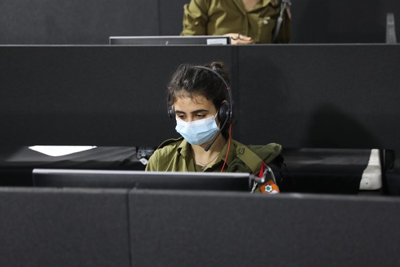 epa08729066 Israeli soldiers in the central national control room Headquarters of the Home Front Command dealing with the coronavirus COVID-19 in the city of Ramla near Tel Aviv, 08 October 2020. The  ...