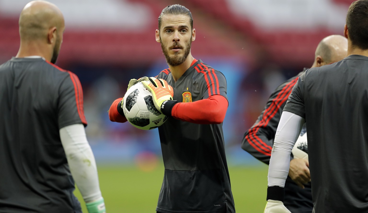 Spain&#039;s goalkeeper David De Gea holds a ball during the official training on the eve of the group B match between Iran and Spain at the 2018 soccer World Cup in the Fisht Stadium in Kazan, Russia ...