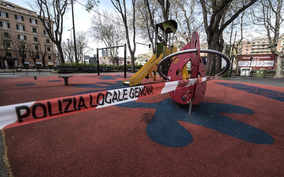 epa08332554 A children's playground remains empty due to the rules against the spread of the SARS-CoV-2 coronavirus which causes the COVID-19 disease, in Genova, Italy, 30 March 2020. Countries around the world are increasing their efforts nd measures to stem the widespread of the disease.  EPA/LUCA ZENNARO