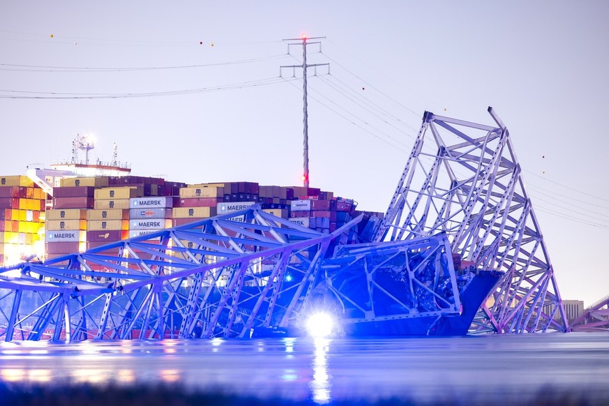 epa11244124 The Francis Scott Key Bridge rests partially collapsed after a container ship ran into it in Baltimore, Maryland, USA, 26 March 2024. The Maryland Department of Transportation confirmed on ...