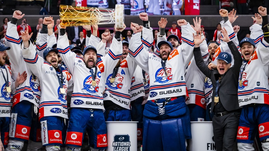 Captain Patrick Geering (ZSC) and players celebrate with the trophy of Swiss Champion after winning by 2:3 during the fifth leg of the National League Swiss Championship final playoff game between Lau ...