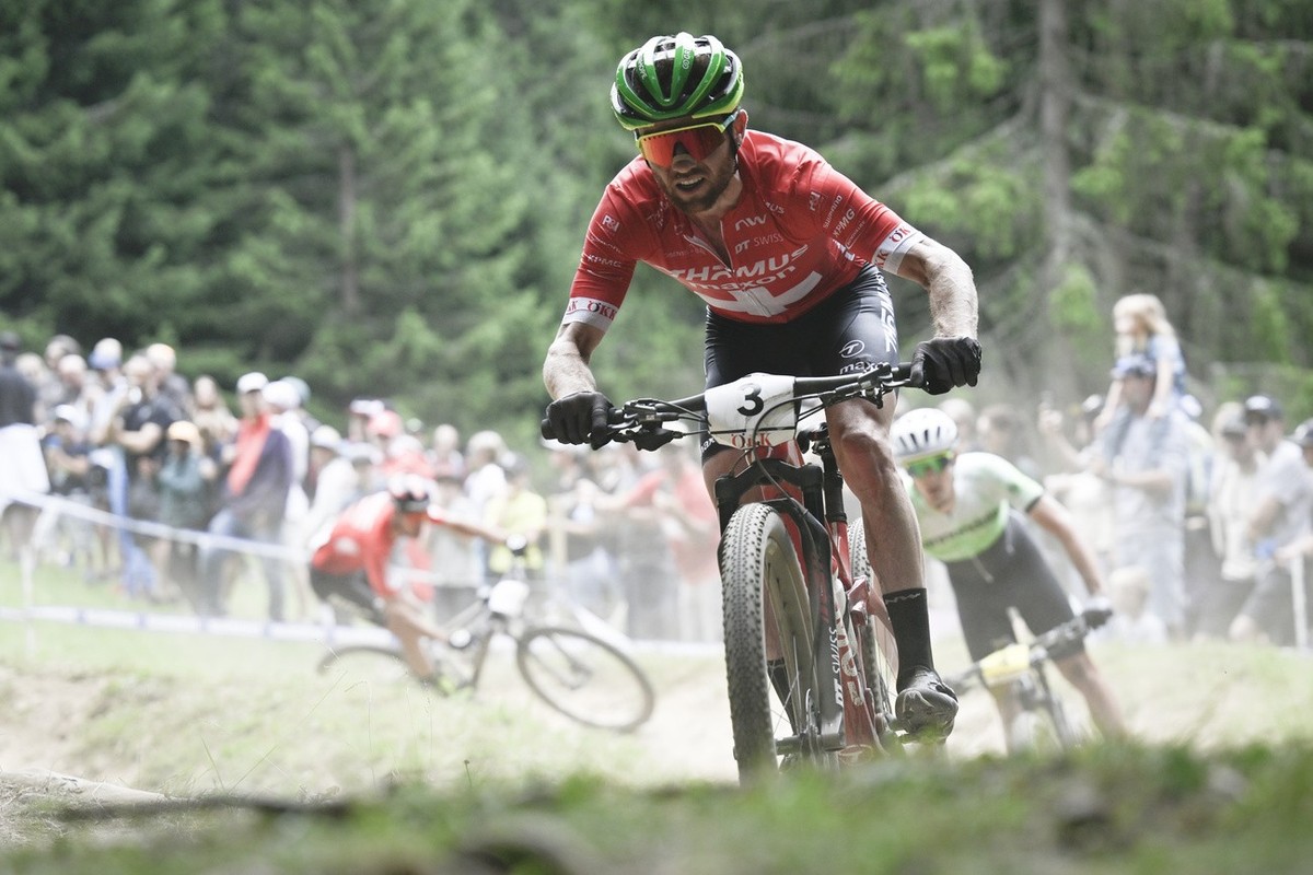 Mathias Flueckiger of Switzerland in action during the UCI Cross Country Mountain Bike race, on Sunday, July 10, 2022, in Lenzerheide, Switzerland. (KEYSTONE/Gian Ehrenzeller)