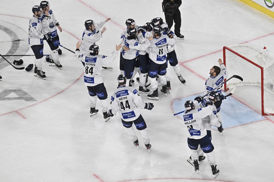 Ambri&#039;s players celebrate after the decisive penalty in the shootout of the final game between Czech Republic&#039;s Sparta Praha and Switzerland&#039;s HC Ambri-Piotta, at the 94th Spengler Cup  ...