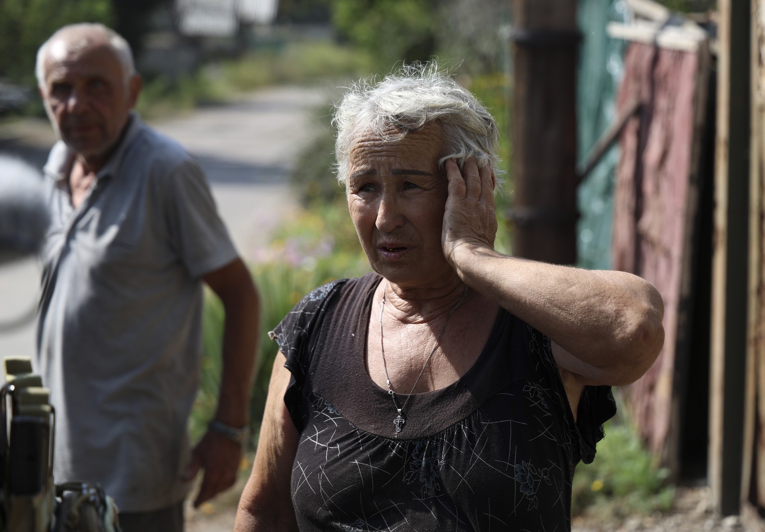 epaselect epa10825890 A local woman reacts as she tells police how her house was recently shelled in the Avdiivka settlement near a front line in the Donetsk region, Ukraine, August 28, 2023. The Pentecost...