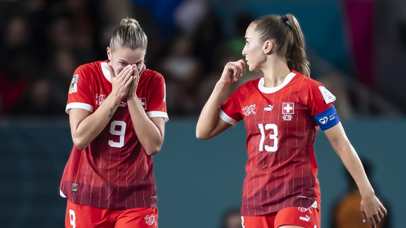 Switzerland&#039;s captain midfielder Lia Waelti, right, forward Ana Maria Crnogorcevic, center, and Julia Stierli, left, show dejection after the team&#039;s 1-5 defeat and elimination from the tourn ...