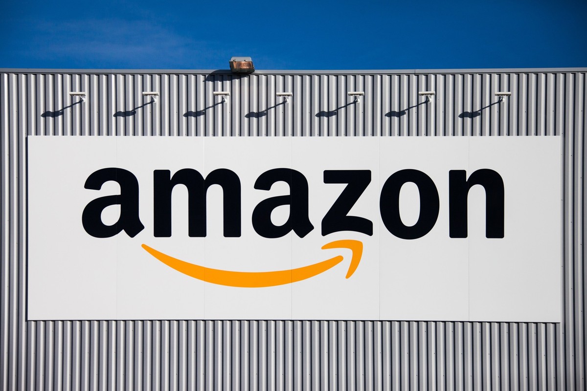 The Amazon logo is seen on the new logistics center of online merchant Amazon in Lauwin-Planque, northern France, Thursday, Sept. 19, 2013. Amazon France plans to create 2500 jobs by 2015 in this cent ...