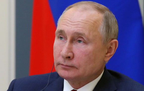 epa08969036 Russian President Vladimir Putin speaks at a session of the Davos Agenda 2021 online forum organized by the World Economic Forum (WEF), via a video link from the Kremlin in Moscow, Russia, ...