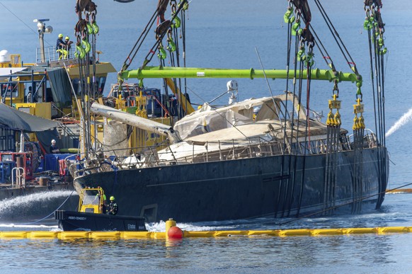 The hull of the superyacht Bayesian, which sank near Palermo, Sicily, on August 19, 2024, is pulled out of the sea and dewatered off the village of Porticello Saturday, June 21, 2025. (AP Photo/Salvat ...