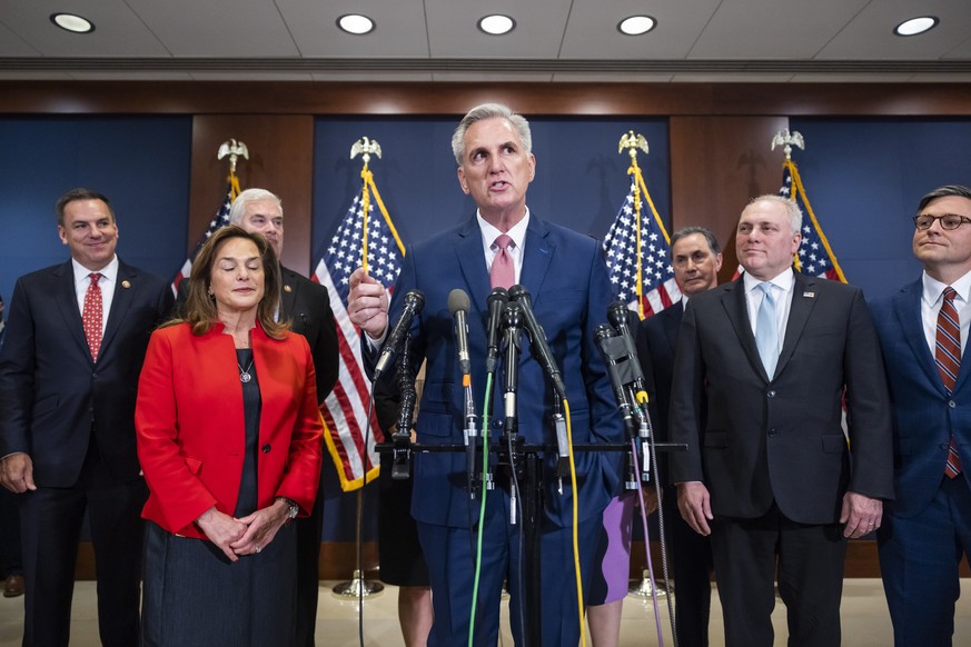 epa10307647 Republican House Minority Leader Kevin McCarthy, surrounded by other leaders-elect, speaks with reporters following a meeting with House Republicans to vote on new members of House leaders ...