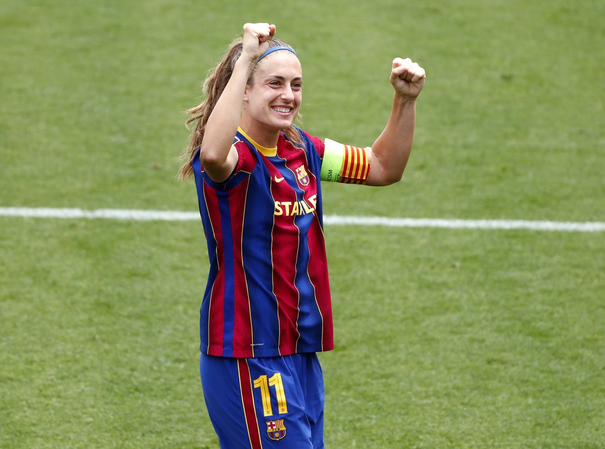 Barcelona's Alexia Putellas waves to supporters after defeating Paris Saint-Germain in their Women's Champions League semifinal second leg soccer match at the Johan Cruyff stadium in Barcelo ...