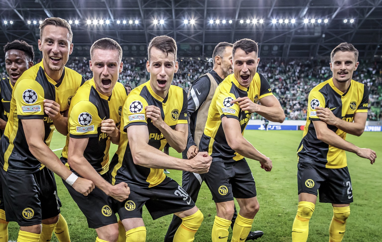 epa09428166 Young Boys' Nicolas Buergy, Michel Aebischer, Sandro Lauper, Vincent Sierro and Quentin Maceiras, from left, celebrate their victory after the UEFA Champions League Play-off second leg soc ...