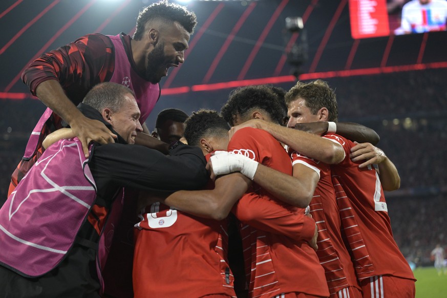 Bayern Munich players celebrate after Bayern&#039;s Leroy Sane scored his side&#039;s second goal during the Champions League, group C soccer match between Bayern Munich and Barcelona at the Allianz A ...