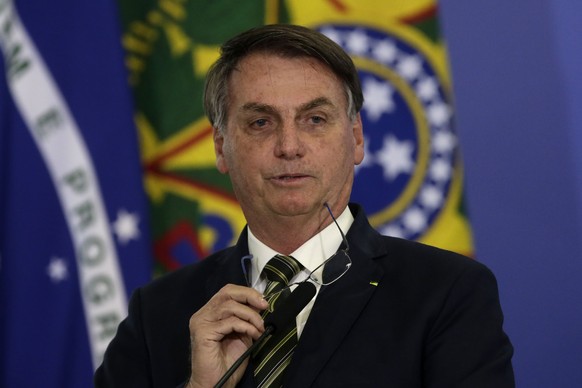 Brazil's President Jair Bolsonaro speaks during the inauguration ceremony of the newly appointed justice minister, at the Planalto presidential palace, in Brasilia, Brazil, Wednesday, April 29, 2020.  ...