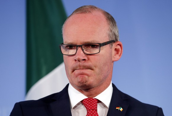 epa06978299 Irish Foreign Minister Simon Coveney gestures next to German counterpart Heiko Maas (unseen), during their joint press conference after their meeting in the Foreign Ministry, in Berlin, Ge ...