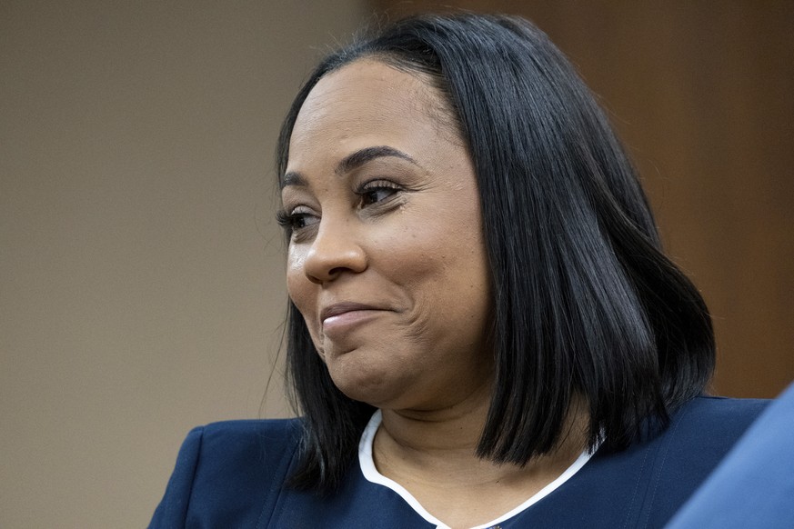 Fulton County District Attorney Fani Willis watchs as potential jurors are excused during proceedings to seat a special purpose grand jury in Fulton County, Georgia, on Monday, May 2, 2022, to look in ...