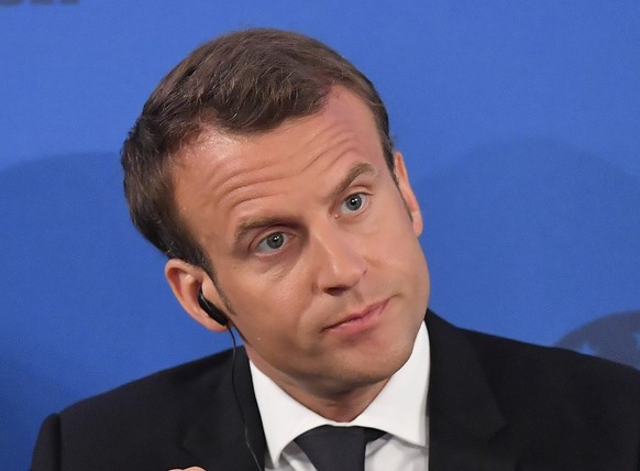 French President Emmanuel Macron looks on on occasion of the Charlemagne Prize awarding to French President Emmanuel Macron in Aachen, Germany, Thursday, May 10, 2018. (AP Photo/Martin Meissner)