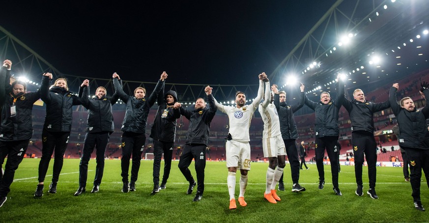 LONDON, ENGLAND - FEBRUARY 22: Ostersunds FK players and staff celebrate after the final whistle at UEFA Europa League Round of 32 match between Arsenal and Ostersunds FK at the Emirates Stadium on Fe ...