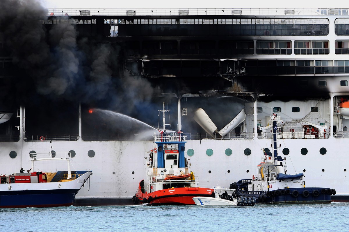 epa09069962 A fire broke out on the 'MSC Lirica' cruiseship on 12 March 2021, while it was tied at the Corfu port, Ionian Sea, Greece, since January 30 for the winter season. Onboard were cr ...