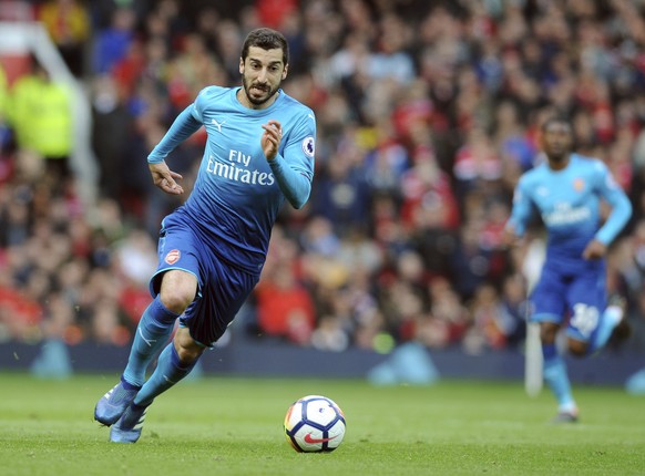 FILE - In this Sunday, April 29, 2018 file photo, Arsenal&#039;s Henrikh Mkhitaryan runs with the ball during their English Premier League soccer match against Manchester United at the Old Trafford st ...