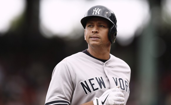 FILE - In this Sept. 14, 2013, file photo, New York Yankees&#039; Alex Rodriguez heads to the dugout during their 5-1 loss to the Boston Red Sox in a baseball game at Fenway Park in Boston. New York i ...