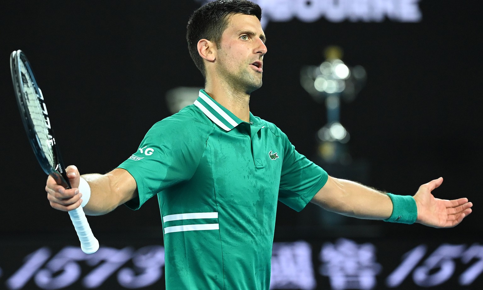 epa09016261 Novak Djokovic of Serbia reacts during his Men&#039;s Quarter finals singles match against Alexander Zverev of Germany on Day 9 of the Australian Open at Melbourne Park in Melbourne, Austr ...