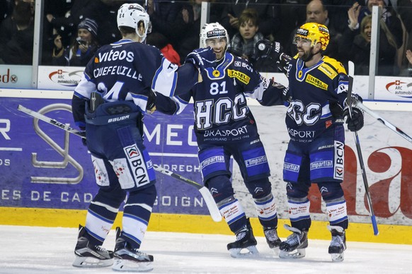 La Chaux-de-Fonds&#039; center Dominic Forget, of Canada, right, celebrates his goal with teammates defender Kevin Hecquefeuille, of France, left, and forward Jerome Bonnet, center, after scoring the  ...