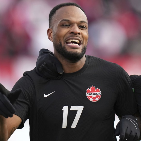 FILE - Canada&#039;s Cyle Larin, 17, celebrates his goal against the United States with teammate Richie Laryea, 22, during the first half of a World Cup soccer qualifier in Hamilton, Ontario, Sunday,  ...