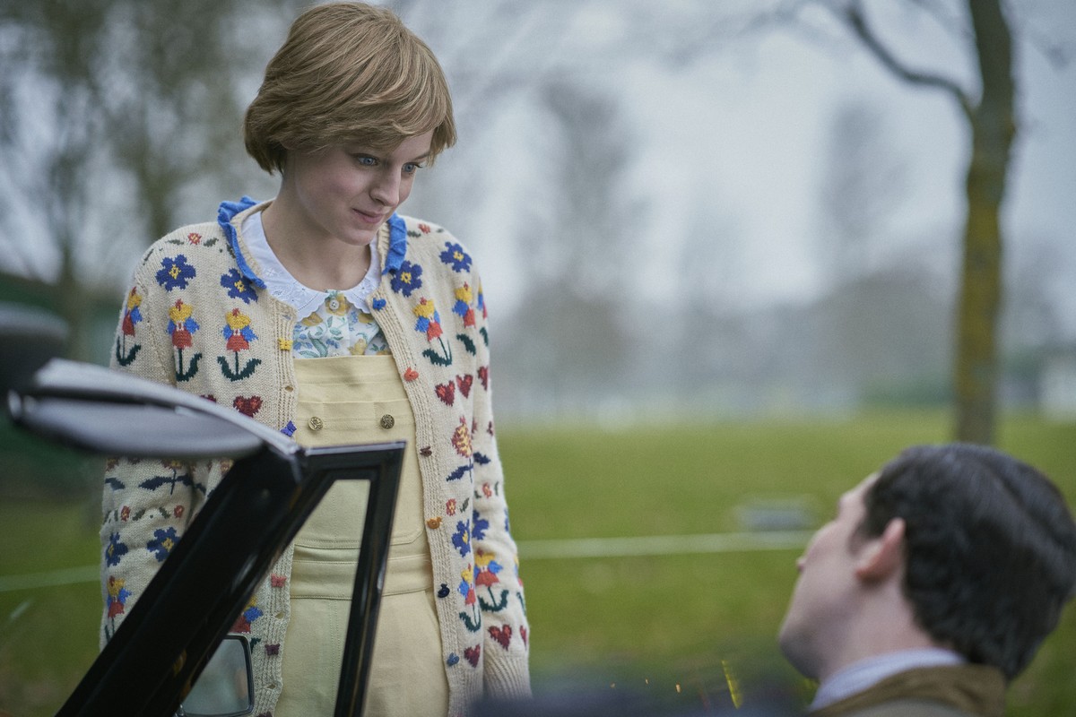 This image released by Netflix shows Emma Corrin, left, and Josh O'Connor in a scene from "The Crown." Season four premieres on Sunday, Nov. 15. (Des Willie/Netflix via AP)