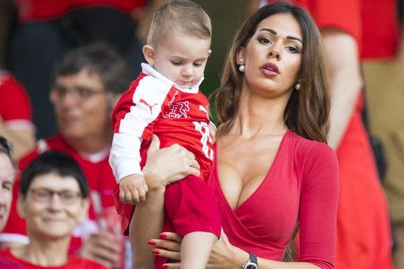 Erjona the wife of Swiss midfielder Blerim Dzemaili, cheers with the baby Luan, during the UEFA EURO 2016 round of 16 soccer match between Switzerland and Poland, at the Geoffroy Guichard stadium in S ...