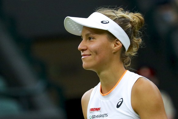 epa09325515 Viktorija Golubic of Switzerland in action against Karolina Pliskova of Czech Republic during their quarter final match at the Wimbledon Championships, Wimbledon, Britain, 06 July 2021. EP ...