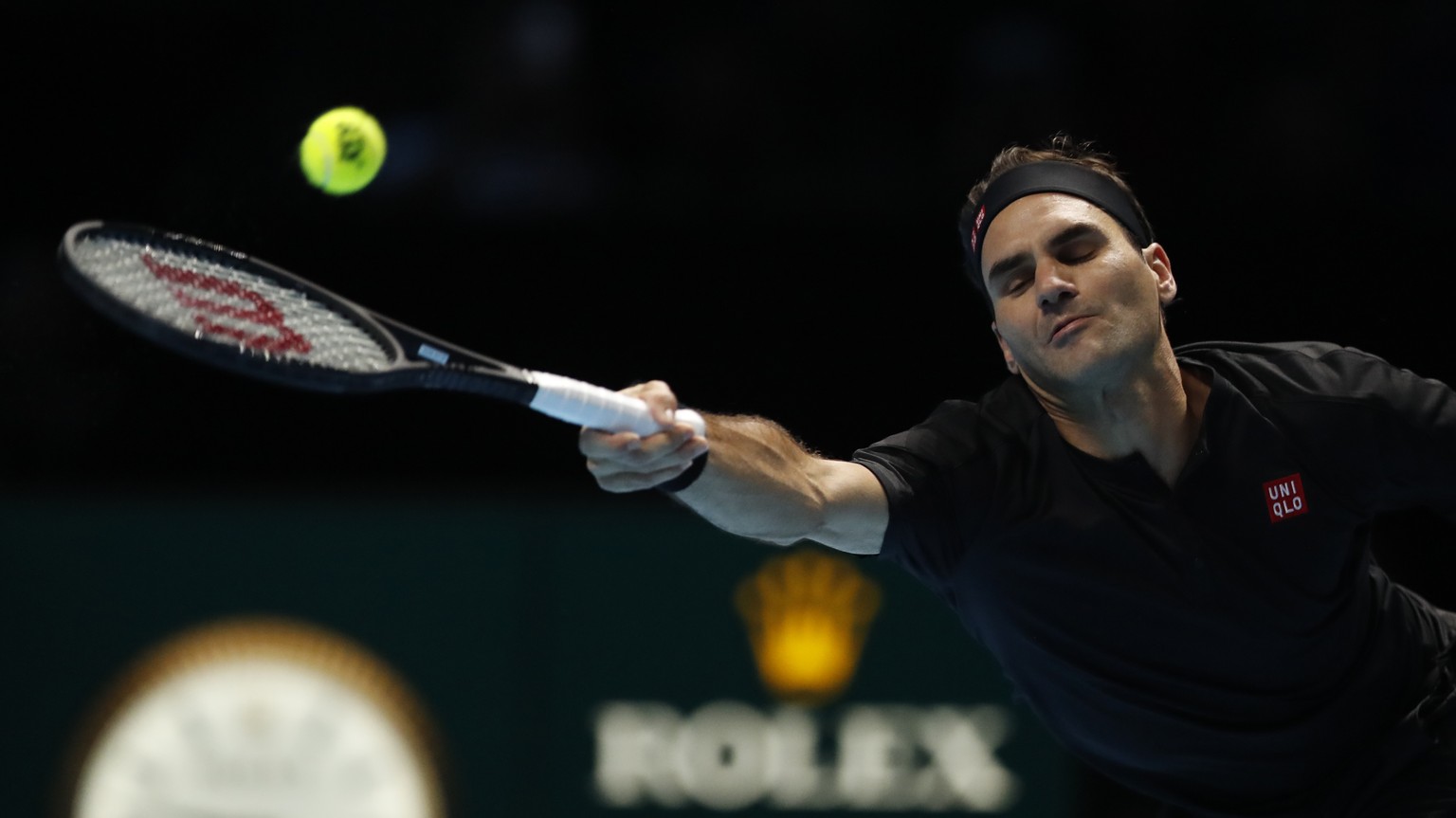 Switzerland&#039;s Roger Federer plays a return to Austria&#039;s Dominic Thiem during their ATP World Tour Finals singles tennis match at the O2 Arena in London, Sunday, Nov. 10, 2019. (AP Photo/Alas ...