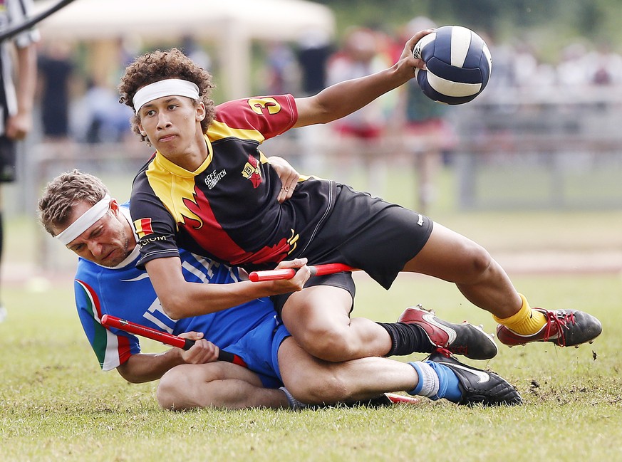 Players from Italy, left, and Belgium fight for the ball during a match of the Quidditch World Championhips in Frankfurt, Germany, Sunday, July 24, 2016. The IQA Quidditch World Championships take pla ...