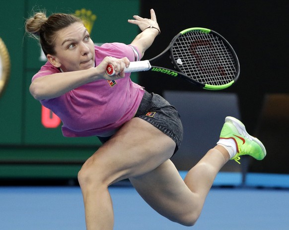 Romania&#039;s Simona Halep makes a forehand return to Estonia&#039;s Kaia Kanepi during their first round match at the Australian Open tennis championships in Melbourne, Australia, Tuesday, Jan. 15,  ...